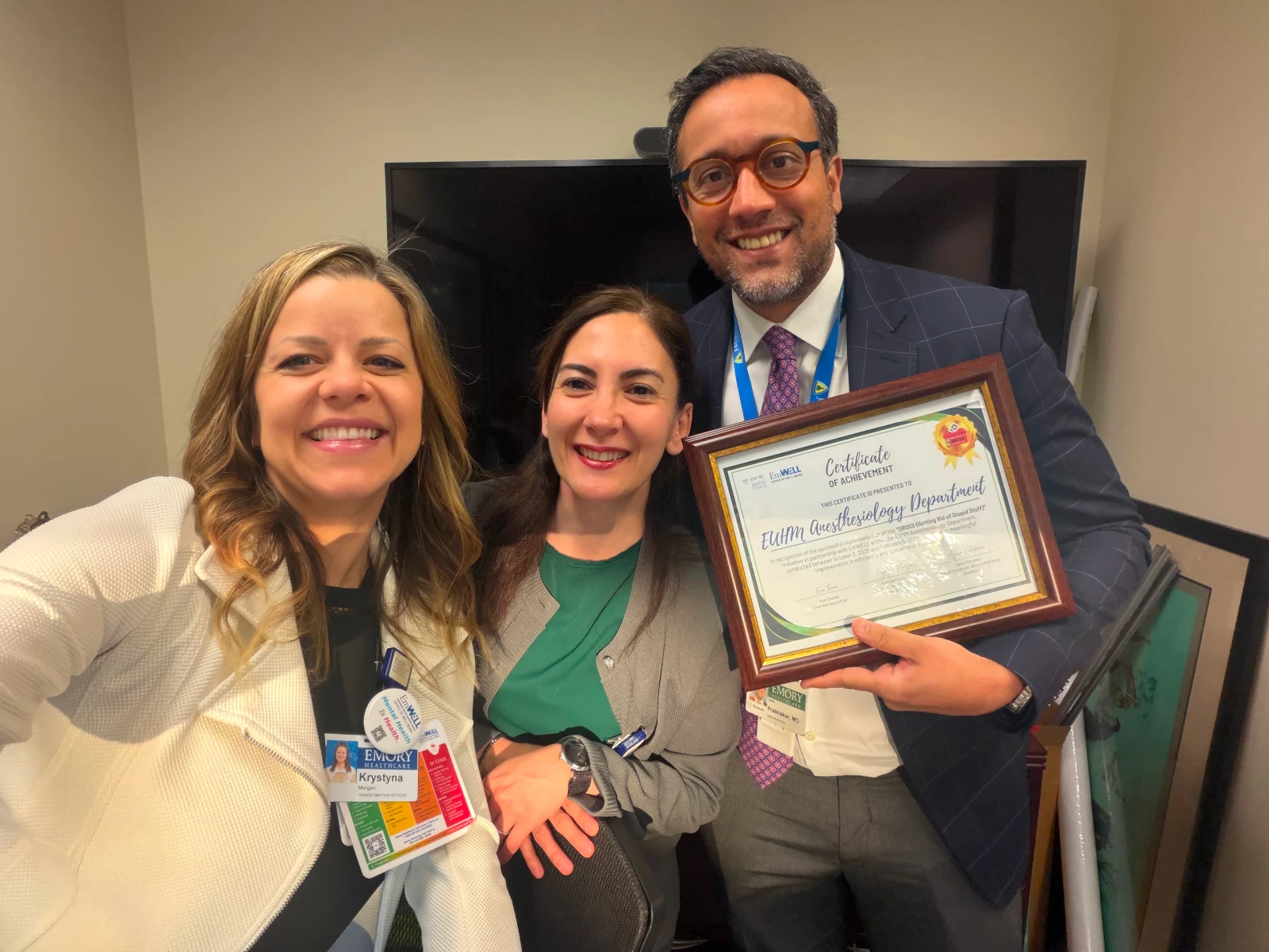 EmWELL team presenting a GROSS Certificate of Achievement to the EUHM Anesthesiology Department